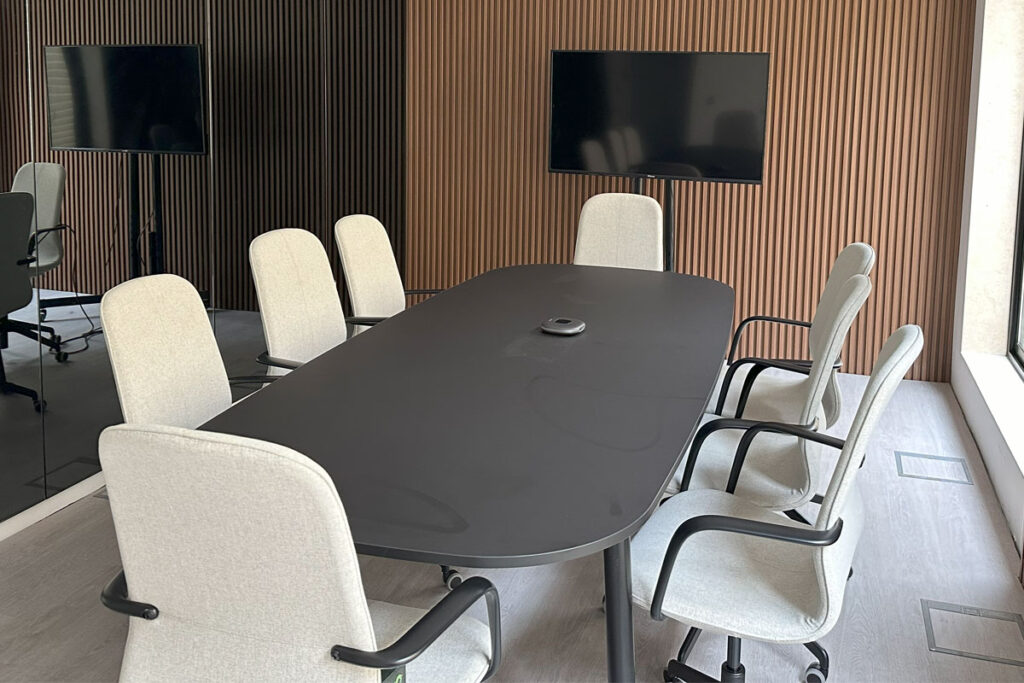 Modern meeting room at Cinemagic equipped for professional presentations.